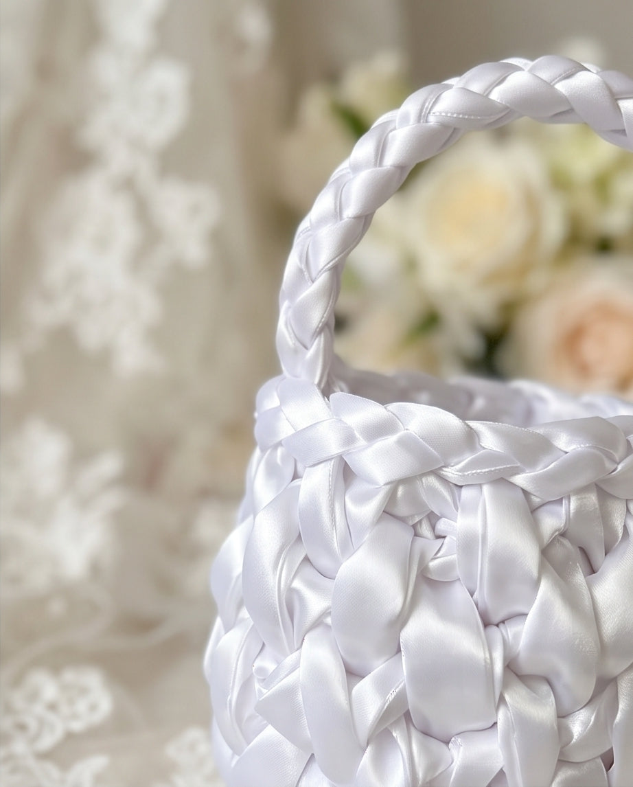 White woven BAG with a blurred floral background