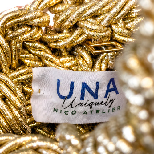 Gold braided cord with a 'UNA UNIQUELY NICO ATELIER' label