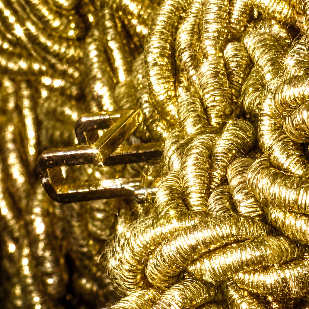 Close-up of a gold rope with a metal clasp