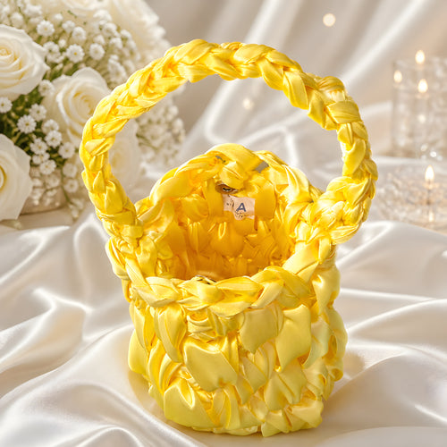 Yellow SATIN CROCHET BAG on a white fabric background with flowers in the background
