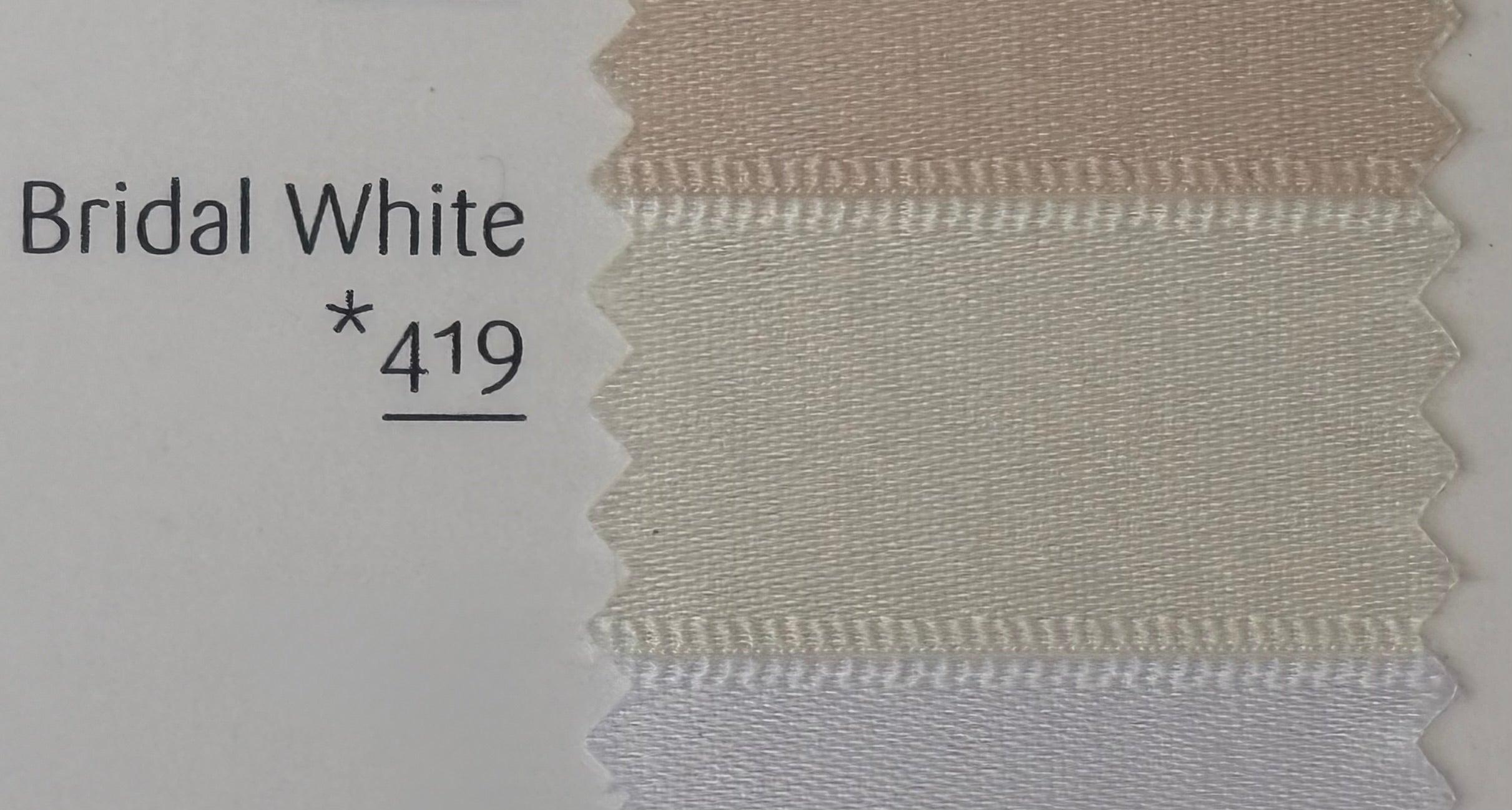 Textile sample with 'Bridal White *419' label on a plain background