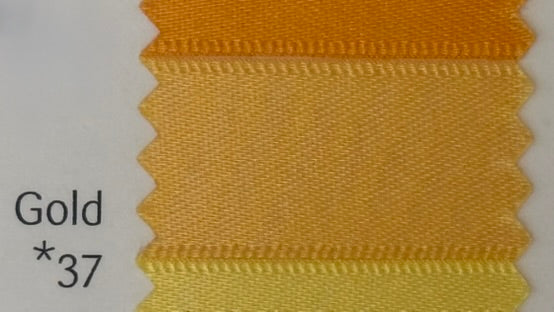 Gold ribbon with a textured pattern on a white background with code 37