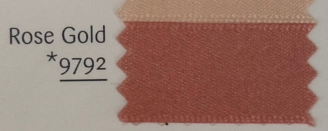 Rose gold fabric swatch with color code 9792 on a beige background