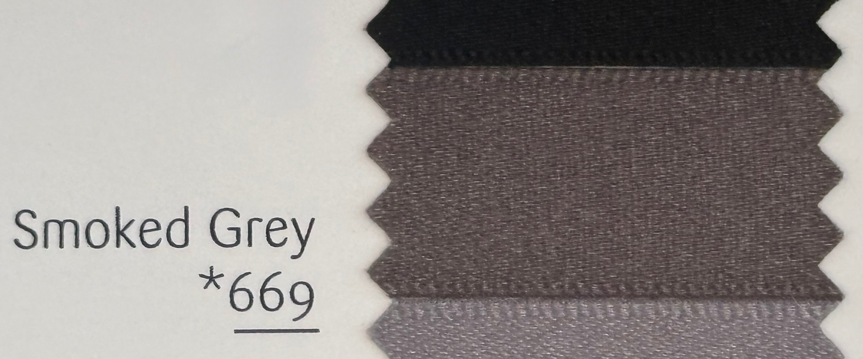 Textured fabric swatch labeled 'Smoked Grey *669' on a white background