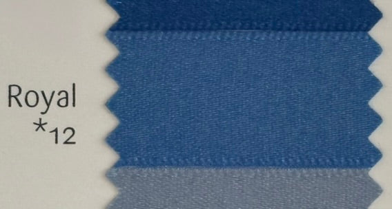 Close-up of blue fabric swatch labeled 'Royal *12' on a white background
