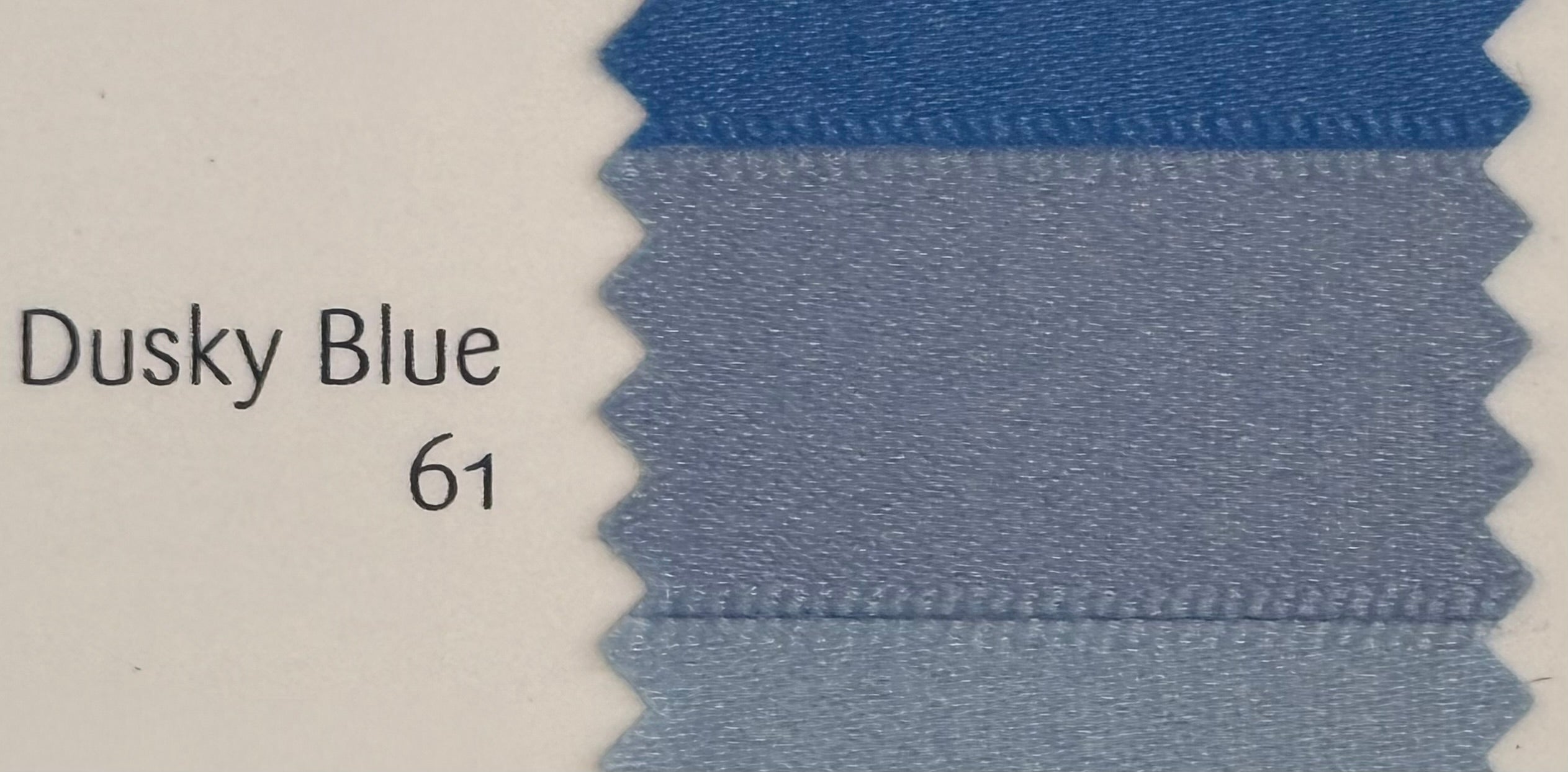 Close-up of DUSKY BLUE fabric swatch with color code 61 on WHITE background