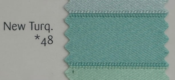 Light blue ribbon with text 'New Turq.*48' on a gray background