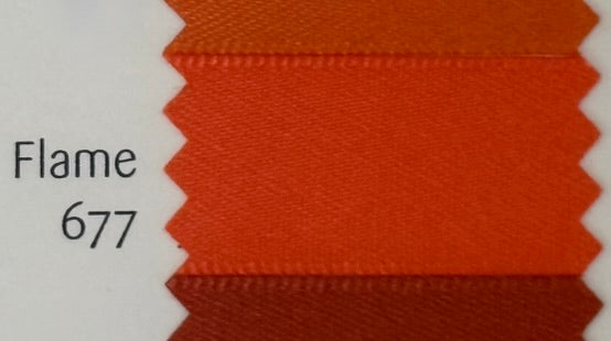 Fabric swatch with 'Flame 677' color on a white background